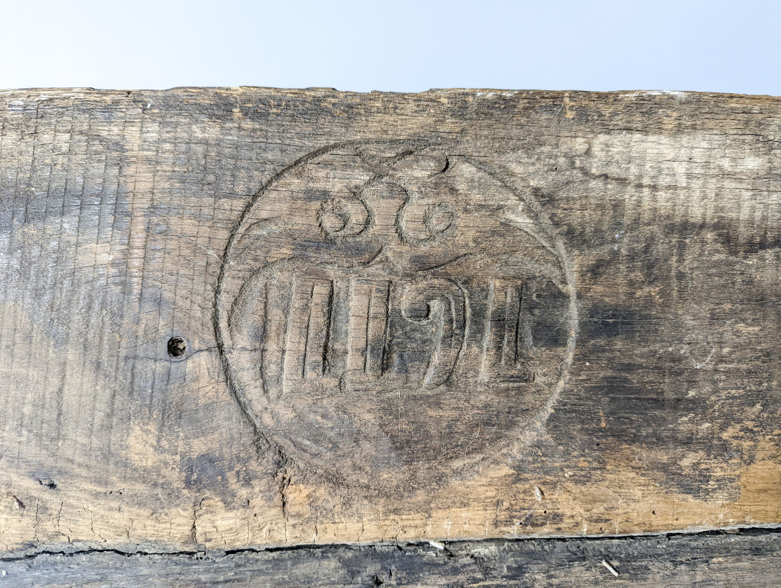 A 17th century style sunken-carved oak panel 37x61cm